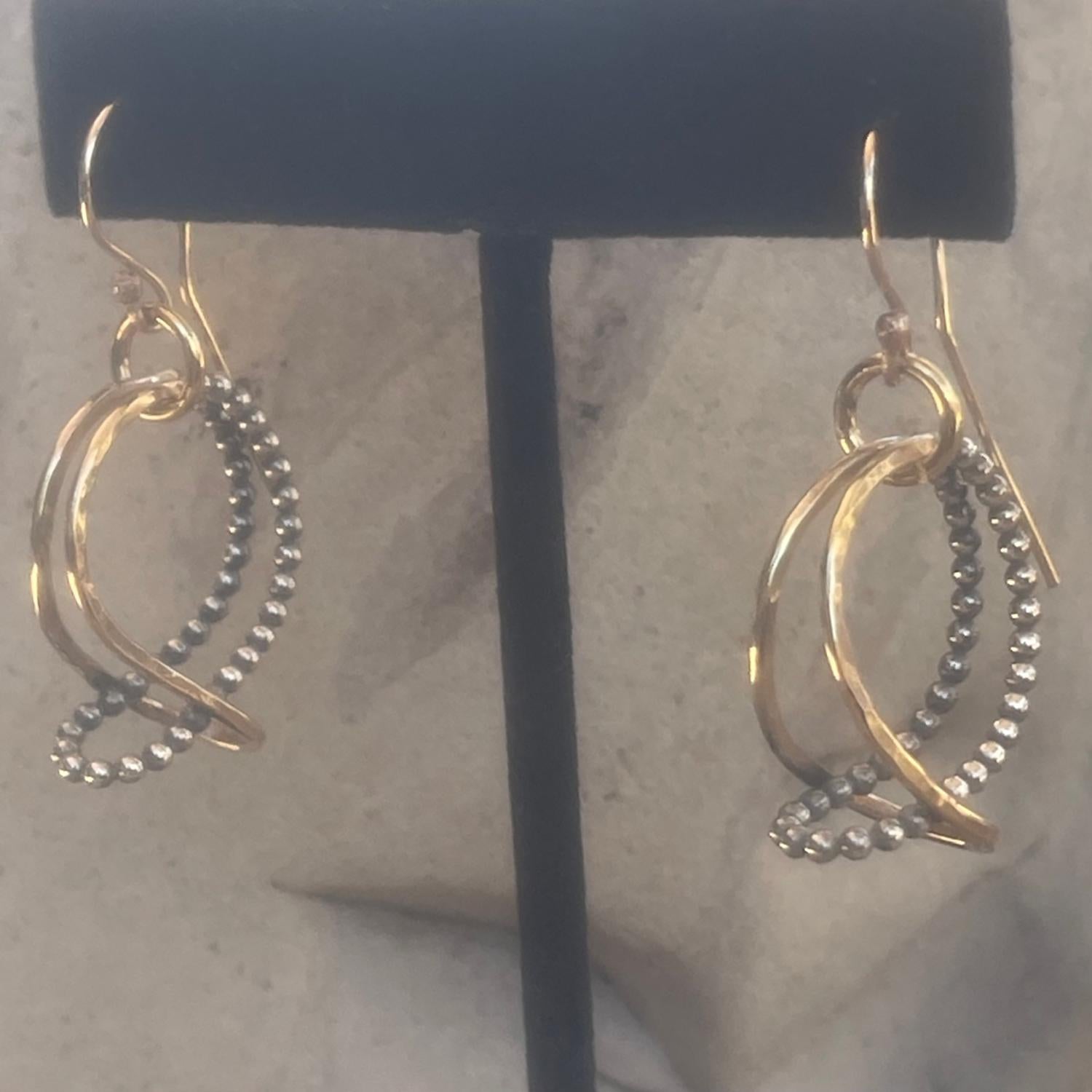 Hammered 14K Gold Filled Looped Double Hoop Earrings with Sterling Silver Beaded Wire.
Available in two sizes 1.5&quot; drop and 2&quot; drop.